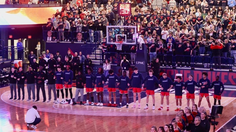 Dayton stands for the national anthem before a game against Duquesne on Friday, Jan. 12, 2024, at the UPMC Cooper Fieldhouse in Pittsburgh. David Jablonski/Staff