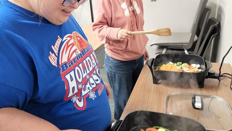 Miami County Board of Developmental Disabilities, or Riverside, partnered recently with the Ohio State University Extension office in Troy for a cooking class as part of instruction in independent living skills. Contributed photo