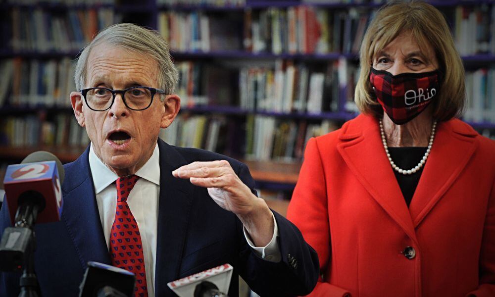 Gov. Mike DeWine addresses the media after touring a COVID-19 vaccination clinic at Thurgood Marshall High school in Dayton. / Staff photo by Marshall Gorby