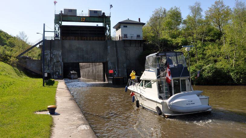 A boat heads toward Lock 17. Locks are elevators for boats, lifting and lowering them as they travel along the waterway. Today, there are 57 locks on New York’s canal system. (Erie Canalway National Heritage Corridor)