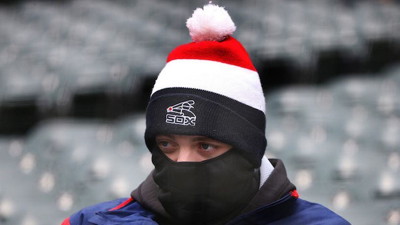 A Sox fan sits bundled against the cold before the Chicago White Sox play the Tampa Bay Rays at Guaranteed Rate Field Monday, April 9, 2018 in Chicago. The Rays won 5-4. (Terrence Antonio James/Chicago Tribune/TNS)