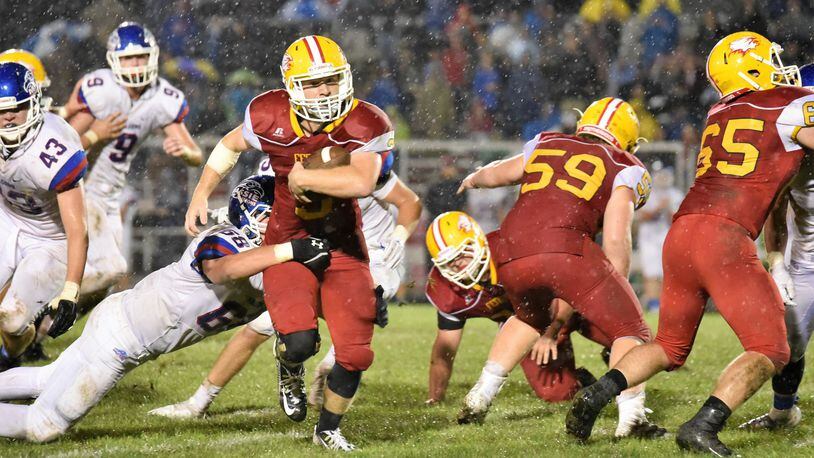 Fenwick’s Jack Fessler cuts through the Clinton-Massie defense during last Friday night’s game at Krusling Field in Middletown. C-M held on for a 21-18 victory. CONTRIBUTED PHOTO BY ANGIE MOHRHAUS