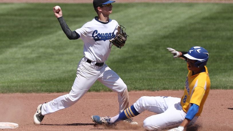 Cincinnati Christian’s Alex Johnson throws to first for the double play after getting Russia’s Daniel Kearns out with the force at second during a Division IV regional semifinal May 24 at Carleton Davidson Stadium in Springfield. BILL LACKEY/STAFF