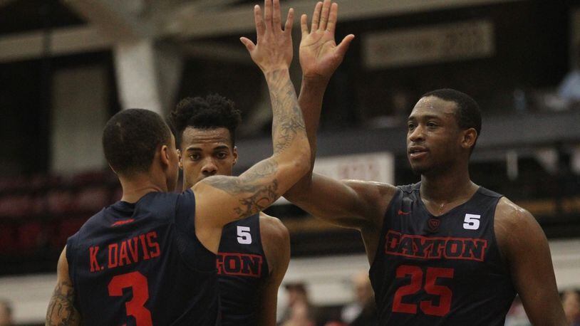 Dayton's Kendall Pollard slaps hands with Kyle Davis after a basket in the second half against Fordham on Tuesday, Jan. 31, 2017, at Rose Hill Gym in Bronx, N.Y.