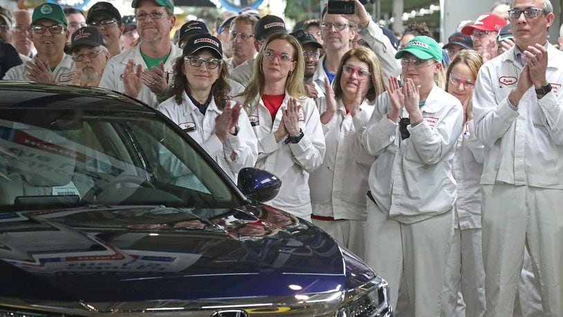 Honda Marysville assembly employees applaud the 25 millionth Honda car produced in the U.S. in a plant celebration last year. Bill Lackey/Staff