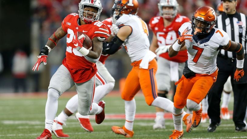 COLUMBUS, OH - NOVEMBER 18:  Mike Weber #25 of the Ohio State Buckeyes runs past Stanley Green #7 of the Illinois Fighting Illini for a 43 yard touchdown run during the first quarter on November 18, 2017 at Ohio Stadium in Columbus, Ohio. Ohio State defeated Illinois 52-14. (Photo by Kirk Irwin/Getty Images)