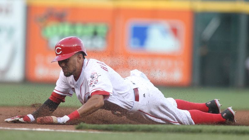 The Reds’ Billy Hamilton steals third base against the Braves on Monday, July 18, 2016, at Great American Ball Park in Cincinnati. David Jablonski/Staff