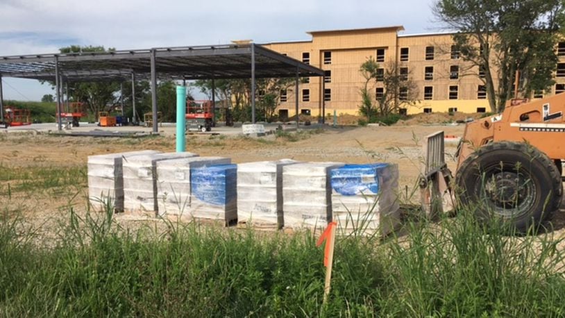 Construction continues at Progress and Hospitality drives on the Hampton Inn & Suites and two retail buildings owned by PS Dayton. Staff Photo/Richard Wilson