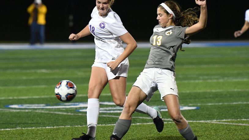 Bellbrook’s Jade Midtlien (left) and Alter’s Karaline Kernan vie for the ball during Tuesday’s Division II regional semifinal. Nick Falzerano/CONTRIBUTED
