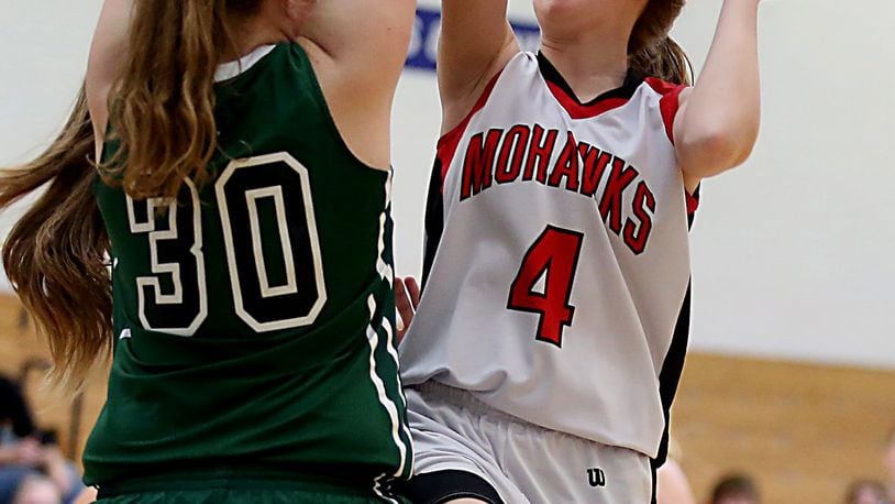Madison guard Ally King shoots over Bethel center Becky Schwieterman during their Division III sectional game at Franklin Monroe on Saturday. CONTRIBUTED PHOTO BY E.L. HUBBARD