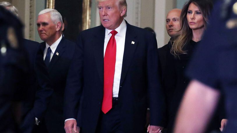WASHINGTON, DC - NOVEMBER 10: President-elect Donald Trump, his wife Melania Trump, and Vice President-elect Mike Pence walk to a meeting with Senate Majority Leader Mitch McConnell at the U.S. Capitol for a meeting November 10, 2016 in Washington, DC. Earlier in the day president-elect Trump met with U.S. President Barack Obama at the White House. (Photo by Mark Wilson/Getty Images)