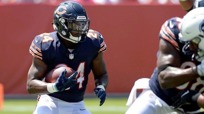 In this Sunday, Aug. 27, 2017 file photo, Chicago Bears running back Jordan Howard (24) runs the ball against the Tennessee Titans in the first half of an NFL football preseason game in Nashville, Tenn. Aaron Rodgers and the Green Bay Packers have regained their hold on the NFC North after a one-year lapse. The Minnesota Vikings, Detroit Lions and Chicago Bears will have to go through Lambeau Field once again if they're going to take the division. (AP Photo/Mark Zaleski, File)