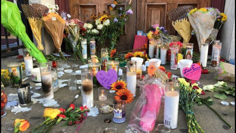 Makeshift memorial in front of Ned Peppers in the Oregon District.
