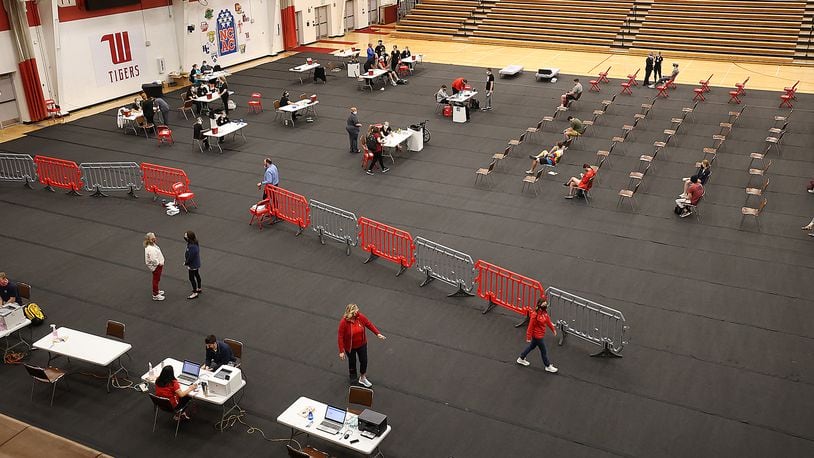 A COVID vaccination clinic is set up in the Pam Evans Smith Arena on the Wittenberg University campus. BILL LACKEY/STAFF