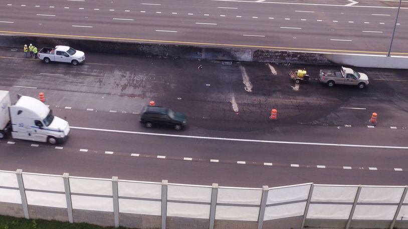 Emergency repair work continued I-75 in Dayton on Monday after a fiery fatal crash closed the highway on Sunday, April 30. A wrong-way driver crashed, head-on, with a gasoline tanker that caught fire. TY GREENLEES / STAFF