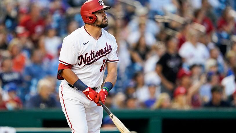Washington Nationals' Kyle Schwarber watches his solo home run during the fifth inning of a baseball game against the New York Mets at Nationals Park, Monday, June 28, 2021, in Washington. (AP Photo/Alex Brandon)
