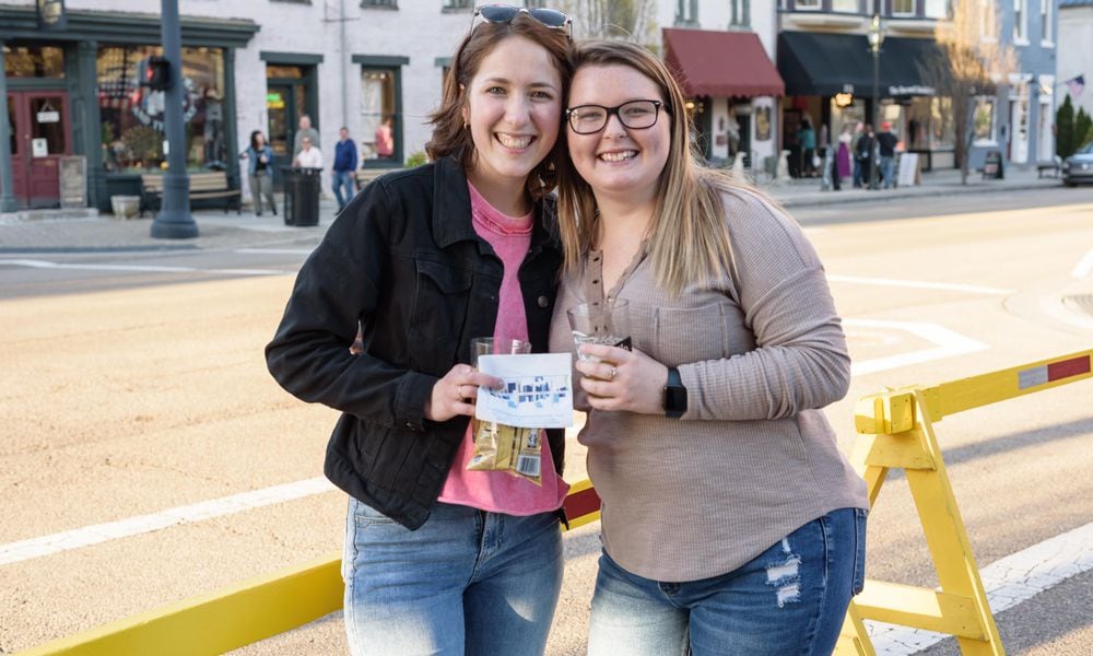 The Downtown Tipp City Partnership hosted the After the Dark Beer Crawl on Saturday, Apr. 13, 2024. Attendees sampled craft beers at shops and businesses on Main St. during the ticketed Second Saturday event. TOM GILLIAM / CONTRIBUTING PHOTOGRAPHER