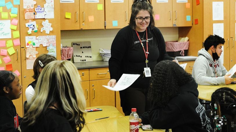 Wayne High School teacher Kaylee Robins teaches a financial literacy course that won an award from the Ohio State Treasurer last year. Huber Heights is one of the districts that has a financial literacy class requirement.  MARSHALL GORBY\STAFF