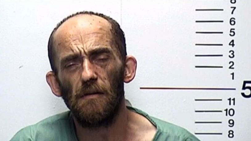 Michael McClain is facing felony charges after a woman discovered him sleeping in her bed with his pants down, holding a hatchet.