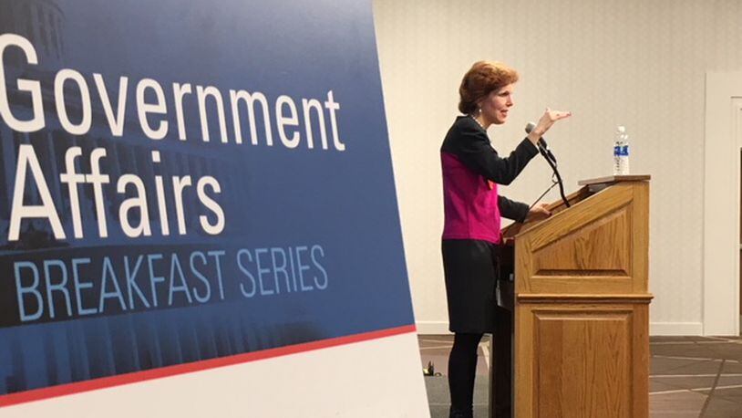 Loretta Mester, president and chief executive of the Federal Reserve Bank of Cleveland, speaks Tuesday morning at a Dayton Area Chamber of Commerce government affairs breakfast meeting. THOMAS GNAU/STAFF