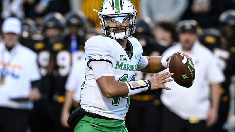 Marshall quarterback Cam Fancher drops back to pass during the first half of the team's NCAA college football game against Appalachian State on Saturday, Nov. 4, 2023, in Boone, N.C. (AP Photo/Matt Kelley)
