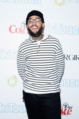 Singer Travie McCoy is the godfather of...
