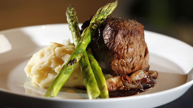 Filet mignon with cipollini onions, bordelaise, grilled asparagus and mashed potatoes from Roost Modern Italian in the Oregon District. The restaurant was founded by chef Dana Downs who takes traditional Italian foods and uses modern techniques and ingredients to develop unique flavors. The dinner-only restaurant is located at 524 E. Fifth St. in Dayton.  LISA POWELL / STAFF