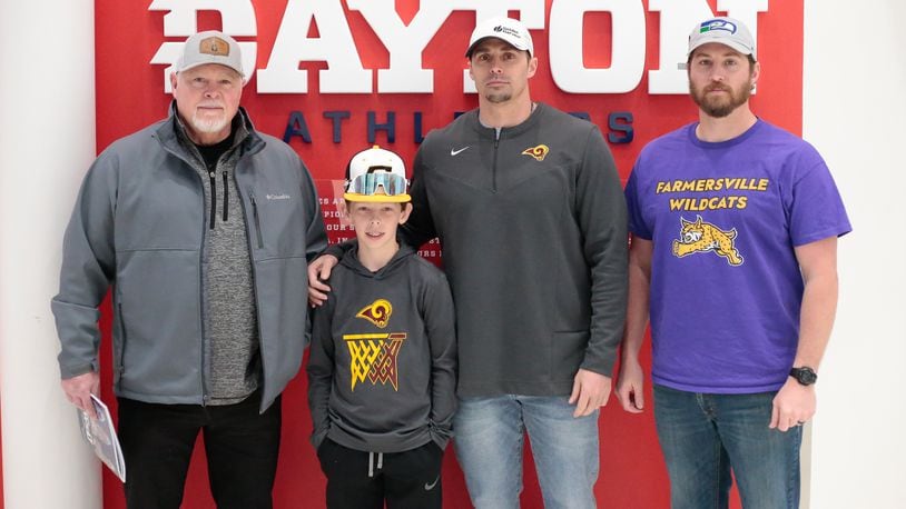 The Buehner family - from left to right, Ted Buehner, JJ Buehner, Ben Buehner and Teddy Buehner - has made attending the annual state boys basketball tournament family tradition. They're seen here at UD Arena on on Friday, March 17, 2023. CONTRIBUTED BY MICHAEL COOPER
