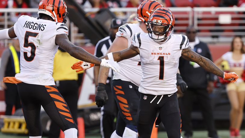 Cincinnati Bengals wide receiver Ja'Marr Chase (1) is congratulated by wide receiver Tee Higgins (5) after scoring against the San Francisco 49ers during the second half of an NFL football game in Santa Clara, Calif., Sunday, Oct. 29, 2023. (AP Photo/Josie Lepe)