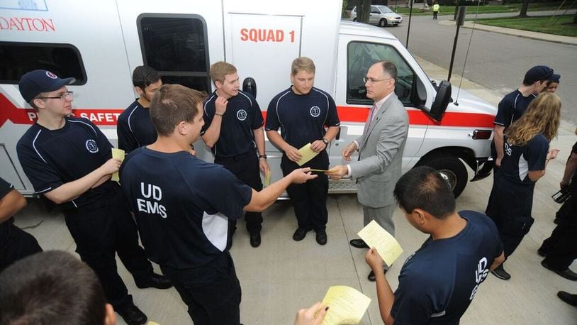 University of Dayton EMS members Chris Reyes, Jason Kleppel, Michael Majercak, Nick Johnson, Austin Hillman and John Thesing talk with university president Eric Spina during a housing blessing of new EMS headquarters last August. “It’s a totally student-run organization,” said Gregory “C.J.” Moellering, a junior who was elected chief of operations this spring. CONTRIBUTED