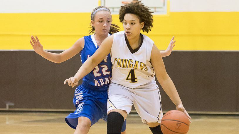 Kenton Ridge’s Desiree Jones dribbles with pressure from Greeneview ‘s Olivia Maxwell during a nonconference game on Monday night. Contributed Photo by Bryant Billing