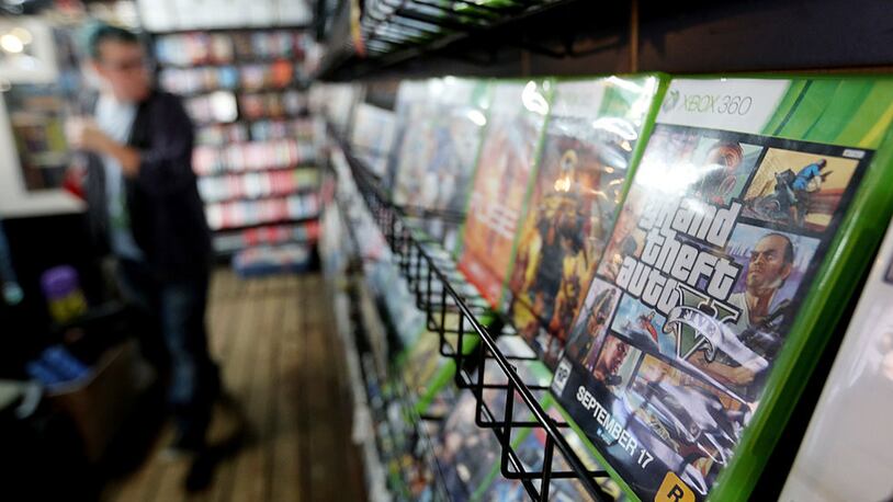 An 11-year-old boy's mother says he bought a used copy of Grand Theft Auto V at a Florida GameStop. She says there was a bag of drugs inside. (Photo by Mario Tama/Getty Images)