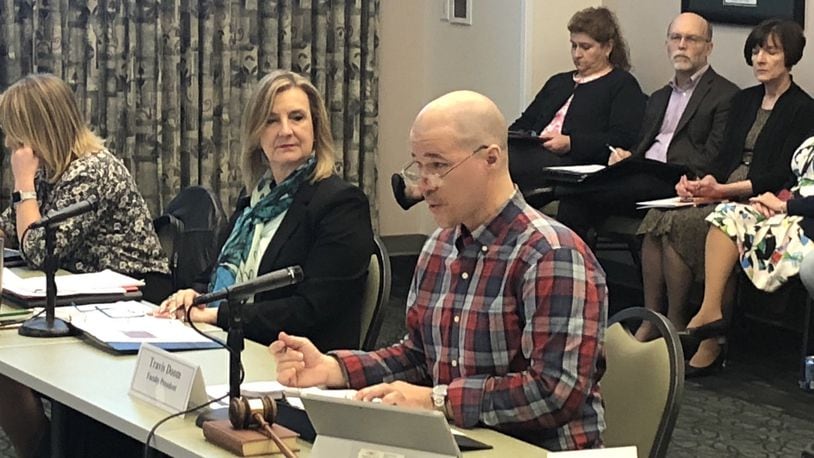 Wright State University president Cheryl Schrader sits next to faculty president Travis Doom during a faculty senate meeting at the school on Monday. Over the weekend and email began circulating calling for the senate to hold a vote of no confidence in Schrader.
