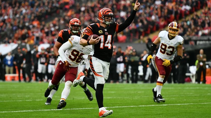 LONDON, ENGLAND - OCTOBER 30: Andy Dalton #14 of the Cincinnati Bengals celebrates as he runs in for a touchdown during the NFL International Series Game between Washington Redskins and Cincinnati Bengals at Wembley Stadium on October 30, 2016 in London, England. (Photo by Dan Mullan/Getty Images)