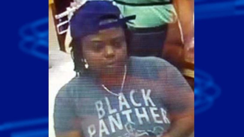 Officials released surveillance of a woman police have dubbed "the red shoe bandit."