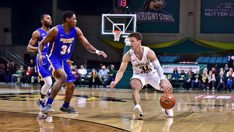 Wright State point guard Cole Gentry looks for room to manuever during Tuesday night’s game vs. Morehead State at the Nutter Center. Joseph Craven/CONTRIBUTED