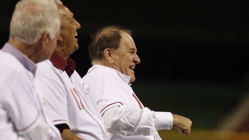Pete Rose laughs while talking to Dave Concepcion during a ceremony honoring Tony Perez on Friday, Aug. 21, 2015, at Great American Ball Park in Cincinnati. David Jablonski/Staff
