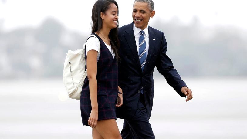 FILE- In this April 8, 2016, file photo, President Barack Obama and his daughter Malia walk from Marine One toward Air Force One at Los Angeles International Airport. Malia is taking a year off after graduating from high school before attending Harvard University as part of an expanding program for students known as a "gap year." (AP Photo/Nick Ut, File)