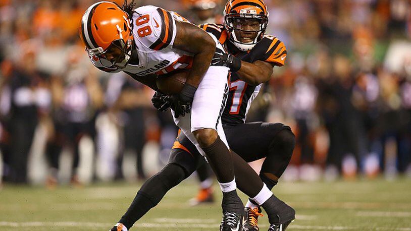 CINCINNATI, OH - NOVEMBER 5: Darqueze Dennard #21 of the Cincinnati Bengals tackles Dwayne Bowe #80 of the Cleveland Browns during the fourth quarter at Paul Brown Stadium on November 5, 2015 in Cincinnati, Ohio. Cincinnati defeated Cleveland 31-10.(Photo by Andrew Weber/Getty Images)
