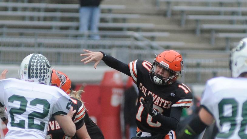 Coldwater quarterback Jack Hemmelgarn fires a pass during Friday’s Division V state championship game at Ohio Stadium. The Cavaliers won their fourth straight state title. STAFF PHOTO/Marc Pendleton