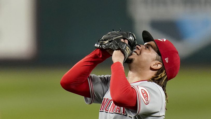 Cincinnati Reds starting pitcher Luis Castillo celebrates after throwing a complete baseball game against the St. Louis Cardinals Friday, Sept. 11, 2020, in St. Louis. The Reds won 3-1. (AP Photo/Jeff Roberson)