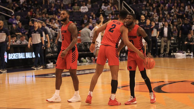 Dayton players (left to right) Trey Landers, Ibi Watson and Jalen Crutcher react after a victory against Saint Mary’s on Sunday, Dec. 8, 2019, at Talking Stick Resort Arena in Phoenix, Ariz. David Jablonski/Staff