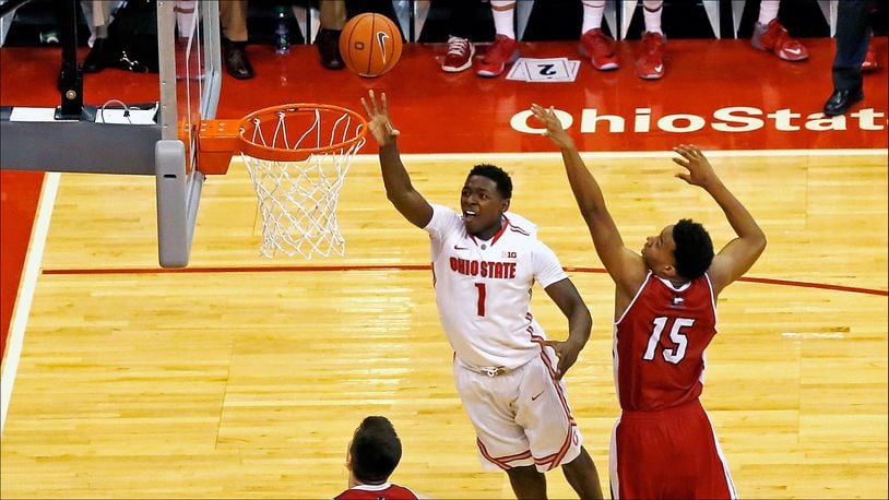 COLUMBUS, OH - DECEMBER 16:  Jae'Sean Tate #1 of the Ohio State Buckeyes shoots the ball after slipping past the defense of Jaylen Key #15 of the Northern Illinois Huskies during the second half at Value City Arena on December 16, 2015 in Columbus, Ohio. Ohio State defeated Northern Illinois 67-54. (Photo by Kirk Irwin/Getty Images)
