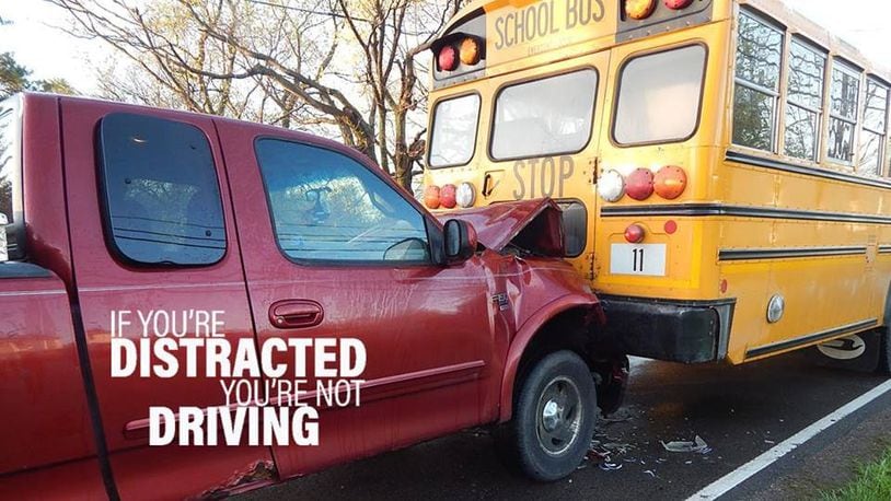 The driver of this pickup truck was texting his girlfriend when he ran into the rear of this school bus. The crash photo was used for an Ohio Highway Patrol campaign against distracted driving. Contributed.