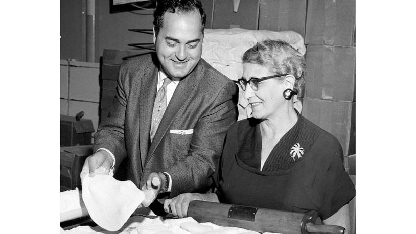 The original caption dated July 7, 1964 reads: "Marking their 11th anniversary this month are the Vic Cassano-Mom Donisi Pizza houses which have grown from a one-store operation to a $3 million a year business. Above, Cassano and Mrs. John (Mom) Donisi, his mother-in-law, are shown in the central commissary from which ingredients are distributed to their pizza outlets." DAYTON DAILY NEWS ARCHIVE