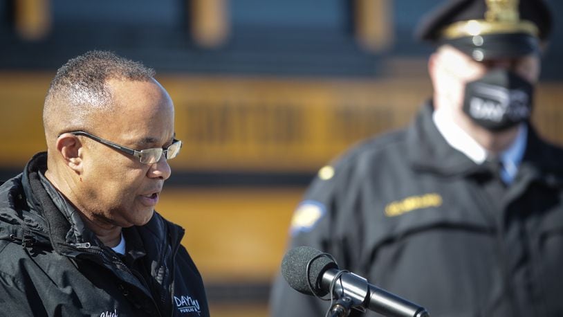 DPS Chief of Safety, Richard Wright II, left and Dayton Police Lt. James Mullins talked to the media Tuesday morning at Dunbar High School about Dayton students' return to in-person school next week.