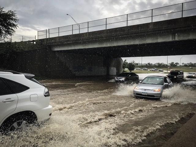 Photos: Flooded streets follow Friday's storms