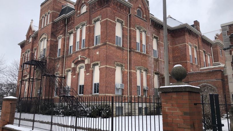 Dayton Public Schools is selling the Longfellow school property at 245 Salem Ave. to an investment group, G.F. Bailey, that hopes to redevelop the site. JEREMY P. KELLEY / STAFF
