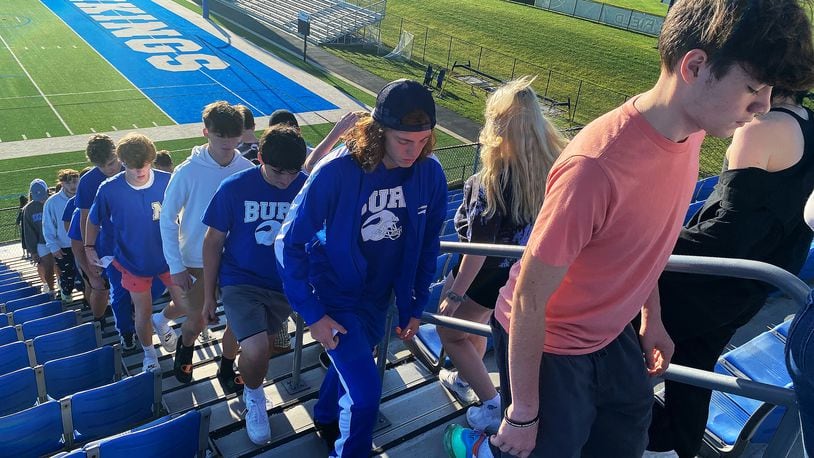 Miamisburg High School students walk up and down the bleachers at Holland Field during the school's second annual 9/11 Stair Climb on Friday, Sept 9, 2022. The event was organized by Siobhan Tirado, an MHS intervention specialist with a focus on history, and social studies teacher Katie Lay. ERIC SCHWARTZBERG/STAFF