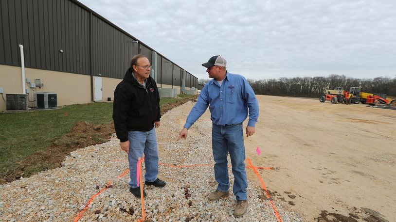 Tom Hensley and his son, Mark, owners of Fab Metals in New Carlisle, talk about the footers that are ready to pour for their new expansion which will more than double the size of their facility and could add as many as 20 to 25 new workers. Bill Lackey/Staff